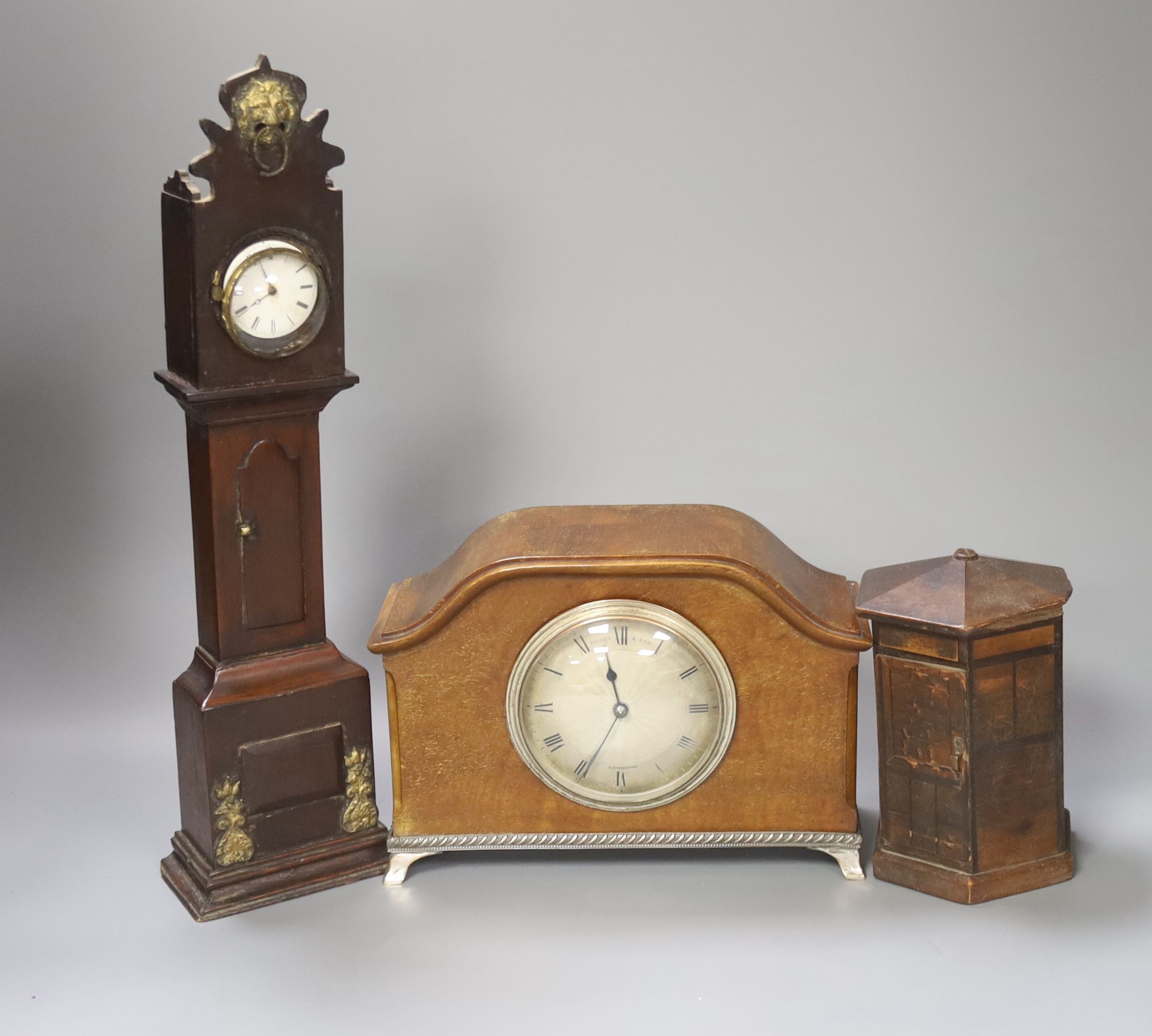 A late Georgian miniature longcase clock with pocket watch dial, puzzle coin box and mantel clock 36cm